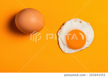 An egg and an egg shell on a yellow background. AI generative image 101641452