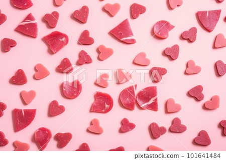 A lot of meat cut hearts on a pink background. AI generative image 101641484