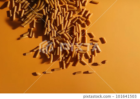 A pile of brown crayons sitting on top of a yellow surface. AI generative image . A lot of copy space. 101641503