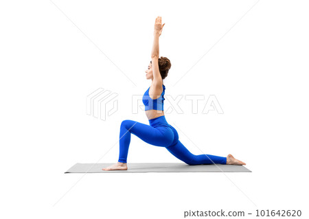Attractive young woman practice deep static lunge exercise with raised hands, isolated on white. 101642620