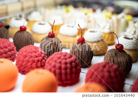 various delicious sweet pastries in the shop window. various delicious sweet pastries in the shop window. 101643440