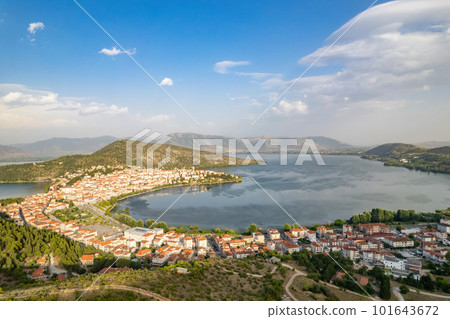 Landscape of countryside town, village and lake of Orestiada in Kastoria during summer sunny day over a mountain peak in Greece. Aerial, drone, top view. Panorama 101643672