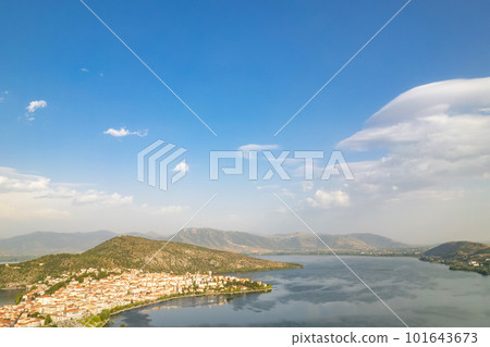 Landscape of countryside town, village and lake of Orestiada in Kastoria during summer sunny day over a mountain peak in Greece. Aerial, drone, top view. Panorama 101643673