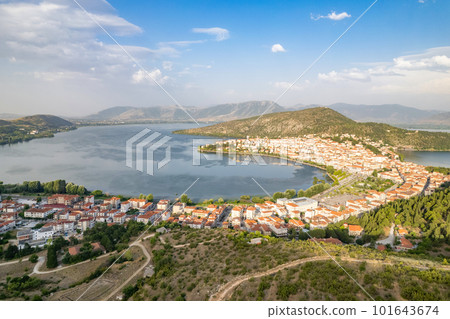 Landscape of countryside town, village and lake of Orestiada in Kastoria during summer sunny day over a mountain peak in Greece. Aerial, drone, top view. Panorama Landscape of countryside town, village and lake of Orestiada in Kastoria during summer sunny day over a mountain peak in Greece. Aerial, drone, top view. Panorama 101643674