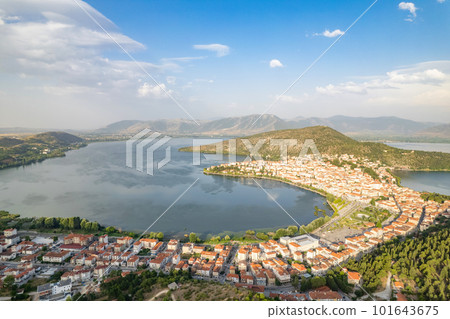 Landscape of countryside town, village and lake of Orestiada in Kastoria during summer sunny day over a mountain peak in Greece. Aerial, drone, top view. Panorama Landscape of countryside town, village and lake of Orestiada in Kastoria during summer sunny day over a mountain peak in Greece. Aerial, drone, top view. Panorama 101643675