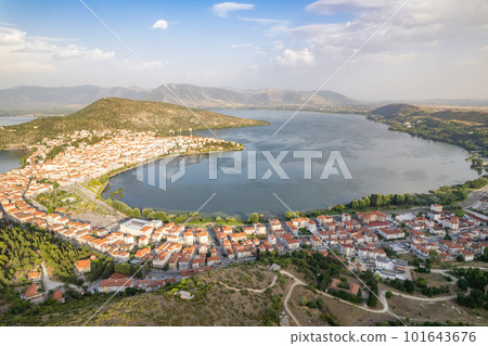 Landscape of countryside town, village and lake of Orestiada in Kastoria during summer sunny day over a mountain peak in Greece. Aerial, drone, top view. Panorama 101643676