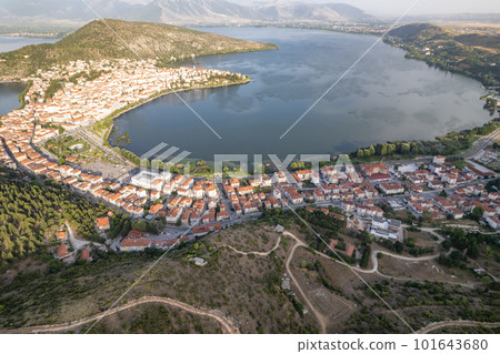 Landscape of countryside town, village and lake of Orestiada in Kastoria during summer sunny day over a mountain peak in Greece. Aerial, drone, top view. Panorama 101643680