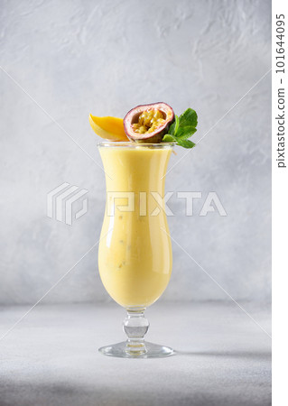 Indian Passion Fruit Lassi on gray background. Indian Passion Fruit Lassi on gray background. 101644095
