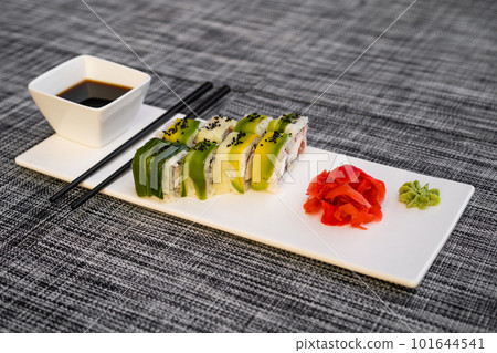 a dish of delicious sushi rolls 101644541