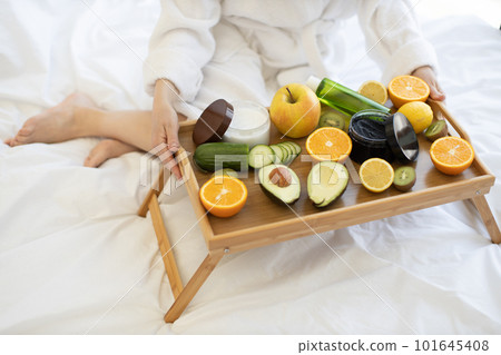 Bed tray with fresh fruits and face skin care products Bed tray with fresh fruits and face skin care products 101645408