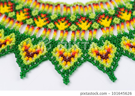 handmade colorful bead necklace close-up isolated on white background. handmade colorful bead necklace close-up isolated on white background. 101645626