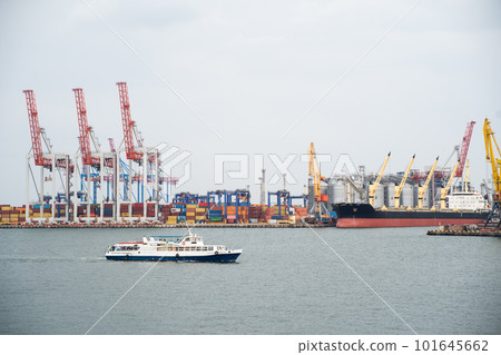 seaport where large cranes are loaded containers on cargo ships seaport where large cranes are loaded containers on cargo ships 101645662