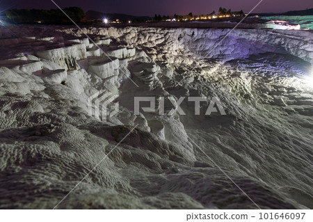 Pamukkale on the top with a view of the city of Denizli at night, Turkey. Pamukkale on the top with a view of the city of Denizli at night, Turkey. 101646097