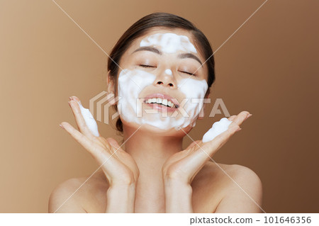 young asian female washing face 101646356
