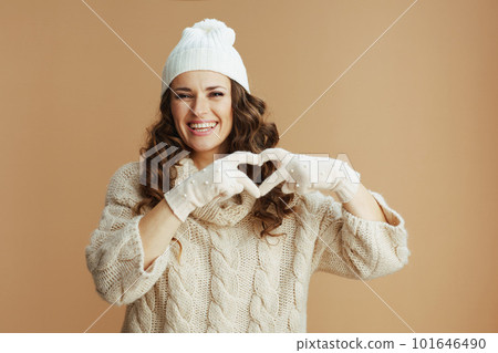 smiling modern woman showing heart shaped hands smiling modern woman showing heart shaped hands 101646490