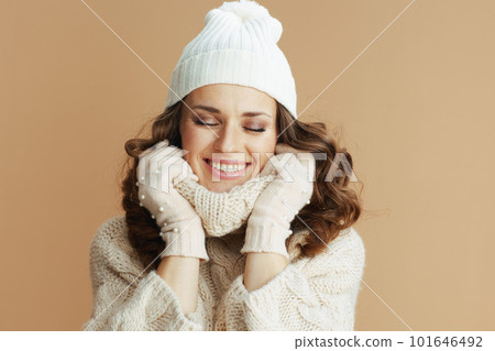 smiling woman on beige wrapped in collar 101646492