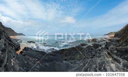 Storm on Castelejo beach with black schist stone cliffs and yelloy sand (Algarve, Portugal). Storm on Castelejo beach with black schist stone cliffs and yelloy sand (Algarve, Portugal). 101647356