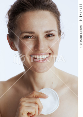 smiling woman with cotton pad 101647511
