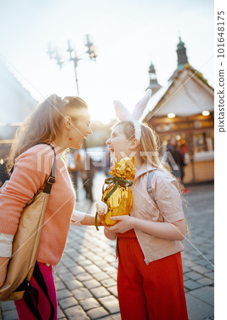 smiling modern mother and teenage daughter at fair in city smiling modern mother and teenage daughter at fair in city 101648175