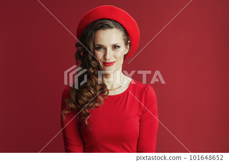 happy stylish woman in red dress and beret isolated on red happy stylish woman in red dress and beret isolated on red 101648652