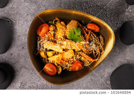 Udon stir-fry noodles with salmon and vegetables. Asian cuisine 101648894