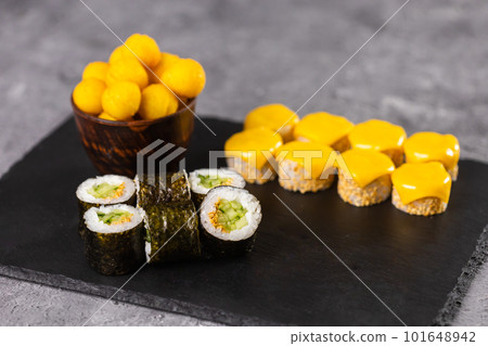 Sushi rolls set on dark background. Japanese and asian food concept 101648942