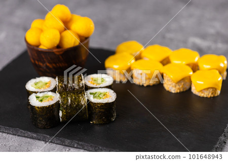 Sushi rolls set on dark background. Japanese and asian food concept Sushi rolls set on dark background. Japanese and asian food concept 101648943