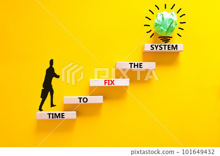 Time to fix the system symbol. Concept words Time to fix the system on wooden block. Beautiful yellow table yellow background. Businessman icon. Business and time to fix the system concept. Copy space 101649432