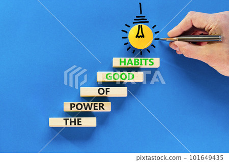 The power of good habits symbol. Concept words The power of good habits on wooden block. Beautiful blue table blue background. Businessman hand. Business the power of good habits concept. Copy space. 101649435