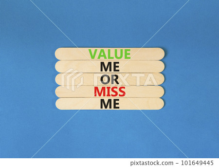 Value or miss me symbol. Concept words Value me or miss me on wooden stick. Beautiful blue table blue background. Business psychological and value or miss me concept. Copy space. 101649445