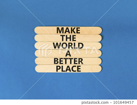 Make a better world symbol. Concept words Make the world a better place on wooden stick. Beautiful blue table blue background. Business make a better world concept. Copy space. 101649457