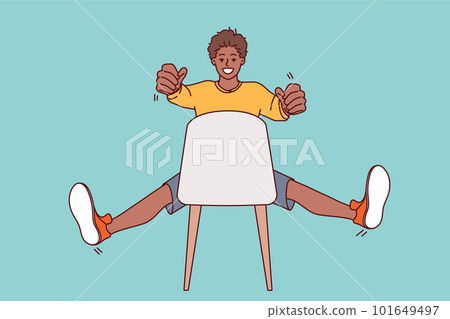 Man sitting on chair holds invisible car steering wheel and imagines that is driving on road Man sitting on chair holds invisible car steering wheel and imagines that is driving on road 101649497