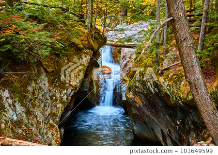 Vermont waterfall in tight gorge at eye level during fall 101649599