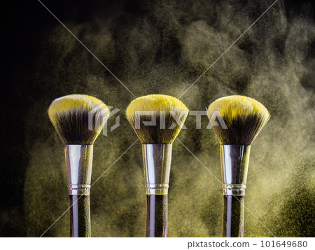Cosmetics brush and explosion colorful makeup powder background - beauty make-up product and mineral cosmetic concept Cosmetics brush and explosion colorful makeup powder background - beauty make-up product and mineral cosmetic concept 101649680
