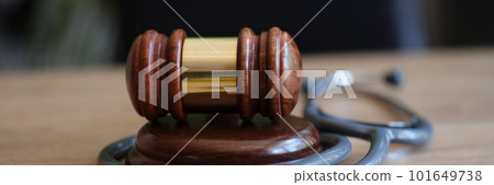 Judge gavel and doctor stethoscope on lawyer office desk 101649738