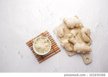 top view of Gingers and powder on chopping board. top view of Gingers and powder on chopping board. 101650366
