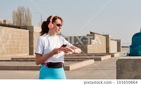 Young woman jogging on city streets Young woman jogging on city streets 101650664