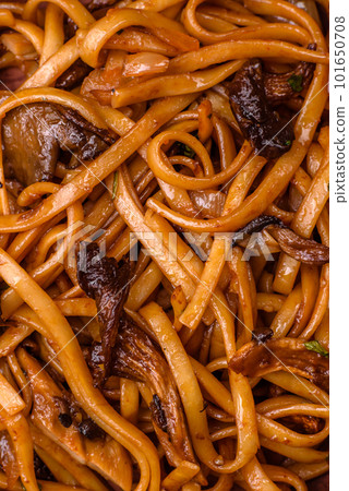 Delicious noodles or udon with mushrooms, salt, spices and herbs Delicious noodles or udon with mushrooms, salt, spices and herbs 101650708