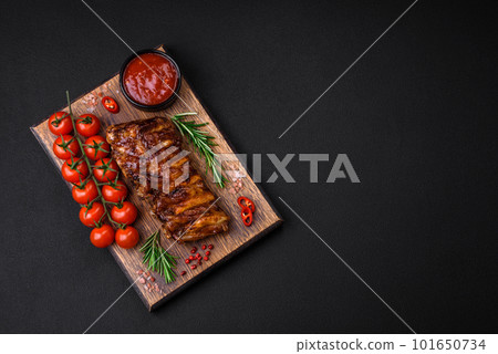 Delicious grilled pork ribs with sauce, spices and herbs 101650734