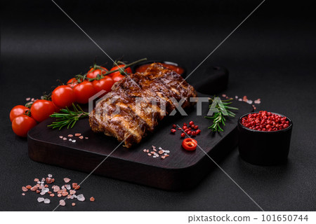 Delicious grilled pork ribs with sauce, spices and herbs Delicious grilled pork ribs with sauce, spices and herbs 101650744