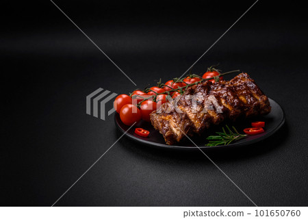 Delicious grilled pork ribs with sauce, spices and herbs 101650760