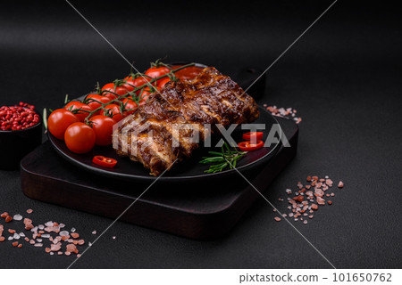 Delicious grilled pork ribs with sauce, spices and herbs Delicious grilled pork ribs with sauce, spices and herbs 101650762