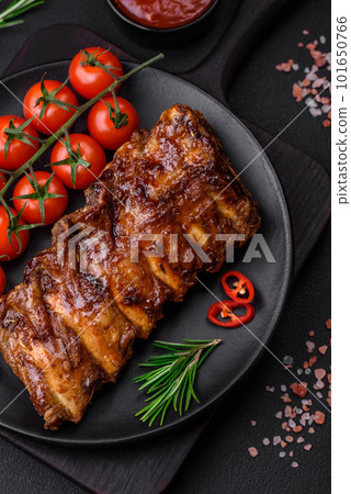 Delicious grilled pork ribs with sauce, spices and herbs Delicious grilled pork ribs with sauce, spices and herbs 101650766