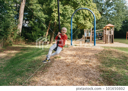 Funny cute happy baby playing on the playground. The emotion of happiness, fun, joy. Smile of a child. boy playing on the playground Funny cute happy baby playing on the playground. The emotion of happiness, fun, joy. Smile of a child. boy playing on the playground 101650802