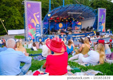 People sitting on blankets during open air concert People sitting on blankets during open air concert 101651639