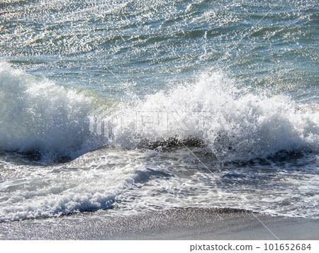Waves crashing on the shore on a windy winter day. Waves crashing on the shore on a windy winter day. 101652684