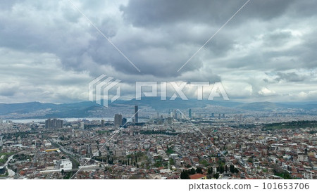 Aerial view of slums and skyscrapers in izmir cityscape on a cloudy day with izmir bay, alsancak harbor Aerial view of slums and skyscrapers in izmir cityscape on a cloudy day with izmir bay, alsancak harbor 101653706