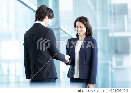 photo of business people shaking hands 101654464