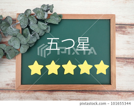 Five star lettering and five stars on chalkboard, satisfaction 101655344
