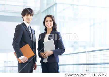Business people lined up in the office lobby Business people lined up in the office lobby 101655947